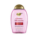 OGX cherry blossom shampoo bottle on a white background
